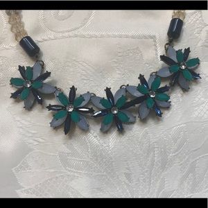 Beaded necklace with floral accents